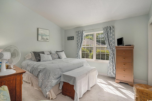 6570 Pebble Beach Cres, Myrtle Beach, SC 29588 - bedroom with light carpet, lofted ceiling, and a textured ceiling