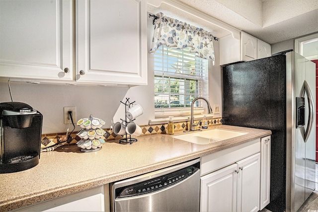 6570 Pebble Beach Cres, Myrtle Beach, SC 29588 - kitchen featuring appliances with stainless steel finishes, white cabinets, and light countertops