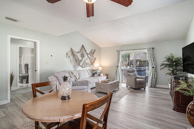 6570 Pebble Beach Cres, Myrtle Beach, SC 29588 - dining area featuring light wood-type flooring, ceiling fan, and a textured ceiling