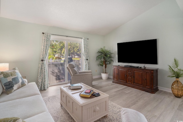 6570 Pebble Beach Cres, Myrtle Beach, SC 29588 - living room featuring lofted ceiling and light wood-style flooring