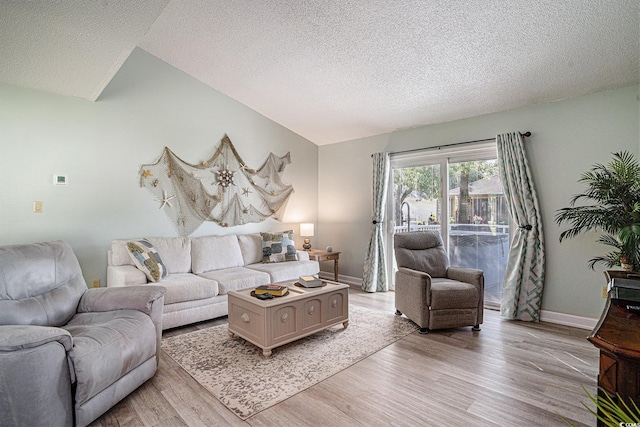 6570 Pebble Beach Cres, Myrtle Beach, SC 29588 - living area with light wood-style floors, a textured ceiling, and lofted ceiling