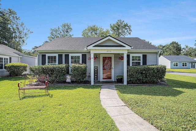 6570 Pebble Beach Cres, Myrtle Beach, SC 29588 - bungalow-style home featuring a front lawn and a shingled roof