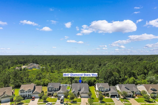 3647 Diamond Stars Way, Little River, SC 29566 - aerial view of residential area featuring a forest