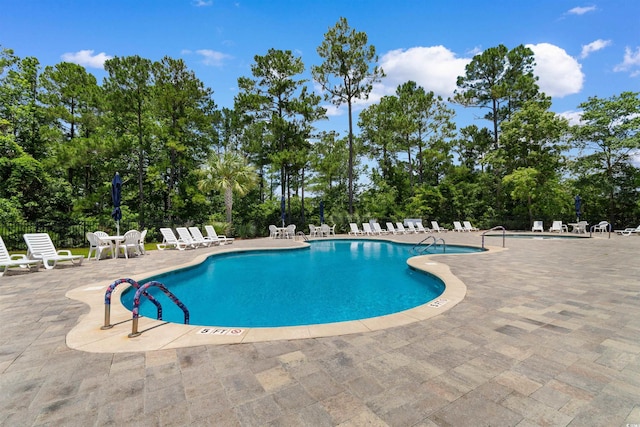 3647 Diamond Stars Way, Little River, SC 29566 - community pool with a patio area and view of scattered trees