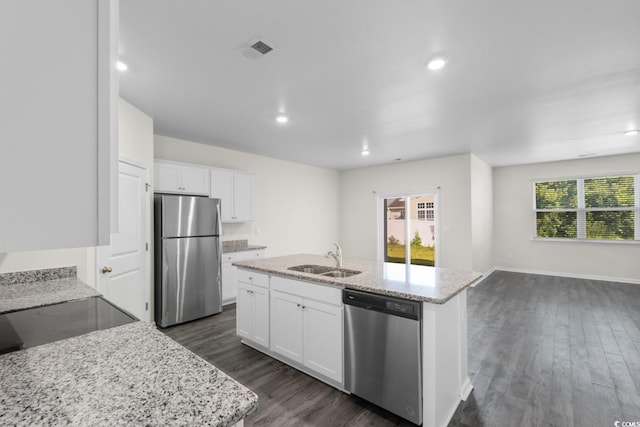 1128 Sennema Cir, Myrtle Beach, SC 29588 - kitchen with appliances with stainless steel finishes, a center island with sink, dark wood-type flooring, white cabinets, and recessed lighting