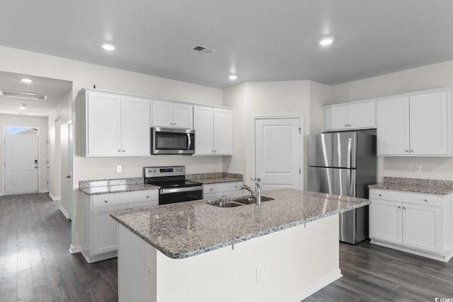 1128 Sennema Cir, Myrtle Beach, SC 29588 - kitchen featuring stainless steel appliances, dark wood-style flooring, white cabinets, light stone counters, and recessed lighting