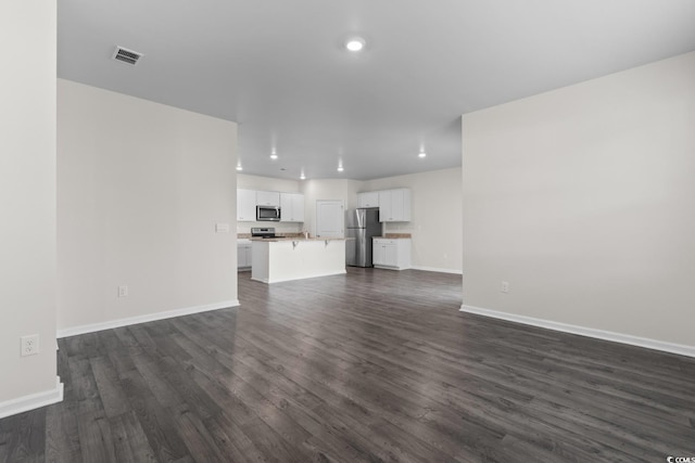 1128 Sennema Cir, Myrtle Beach, SC 29588 - unfurnished living room featuring dark wood-type flooring and recessed lighting