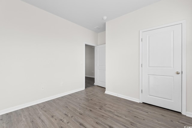 1128 Sennema Cir, Myrtle Beach, SC 29588 - unfurnished bedroom with wood finished floors and baseboards