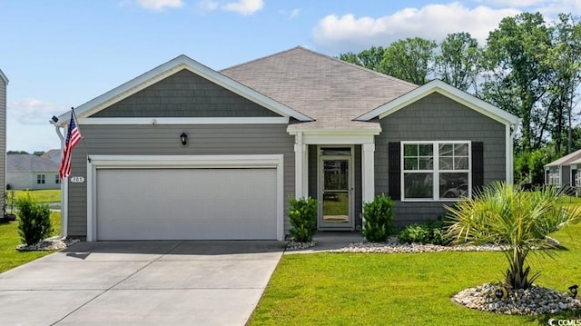 305 Forestbrook Cove Cir, Myrtle Beach, SC 29588 - view of front of property with a garage, concrete driveway, a front yard, and a shingled roof