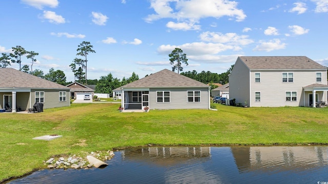 305 Forestbrook Cove Cir, Myrtle Beach, SC 29588 - back of property featuring a lawn, a water view, and a sunroom