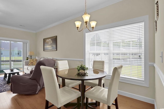 8855 Radcliff Dr NW Unit 50B, Calabash, NC 28467 - dining area with a chandelier, healthy amount of natural light, wood finished floors, and crown molding