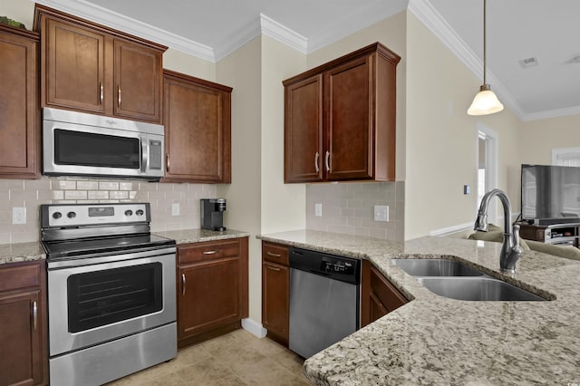 8855 Radcliff Dr NW Unit 50B, Calabash, NC 28467 - kitchen with stainless steel appliances, ornamental molding, light stone counters, tasteful backsplash, and pendant lighting