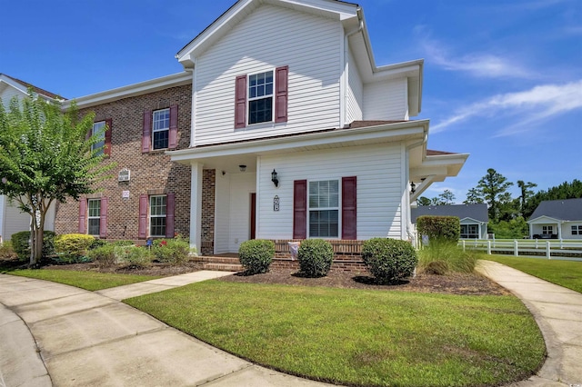 8855 Radcliff Dr NW Unit 50B, Calabash, NC 28467 - view of front of house featuring brick siding and a porch
