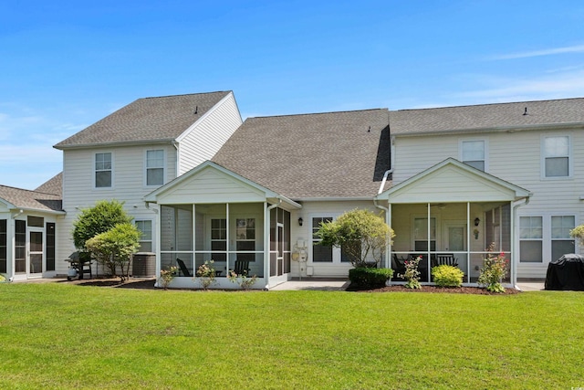 310 Lockerbie Ct Unit 1057, Myrtle Beach, SC 29577 - rear view of house featuring a sunroom and a yard