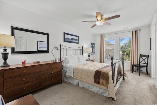 310 Lockerbie Ct Unit 1057, Myrtle Beach, SC 29577 - bedroom featuring light carpet, a textured ceiling, and a ceiling fan