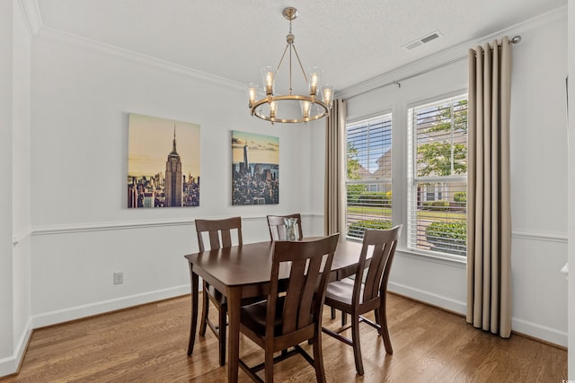 310 Lockerbie Ct Unit 1057, Myrtle Beach, SC 29577 - dining space with a chandelier, crown molding, wood finished floors, and a textured ceiling