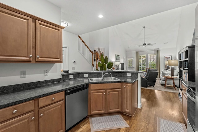 310 Lockerbie Ct Unit 1057, Myrtle Beach, SC 29577 - kitchen with stainless steel dishwasher, a peninsula, dark wood-type flooring, ceiling fan, and brown cabinetry