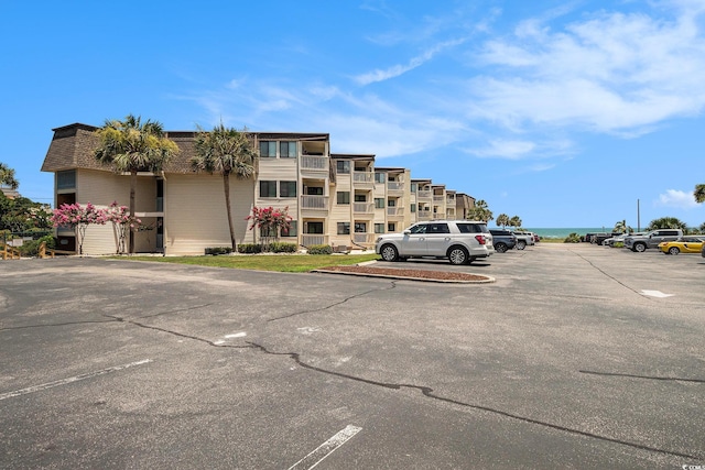 5601 N Ocean Blvd Unit E-113, Myrtle Beach, SC 29577 - view of property featuring uncovered parking