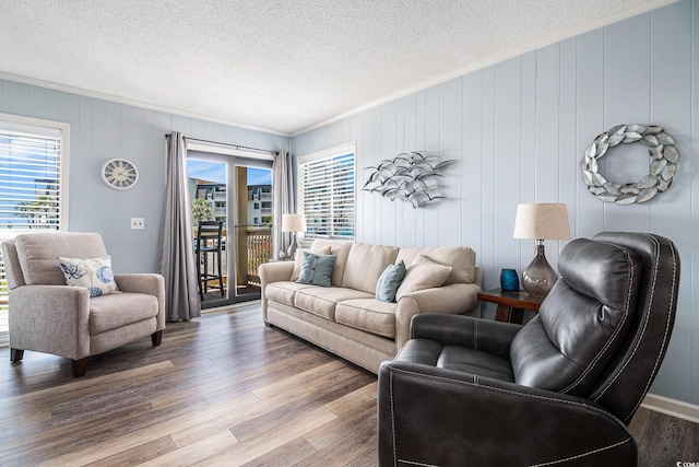 5601 N Ocean Blvd Unit E-113, Myrtle Beach, SC 29577 - living room with plenty of natural light, ornamental molding, wood finished floors, and a textured ceiling