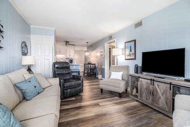 5601 N Ocean Blvd Unit E-113, Myrtle Beach, SC 29577 - living area featuring dark wood-style flooring, crown molding, and a ceiling fan