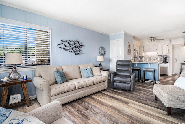 5601 N Ocean Blvd Unit E-113, Myrtle Beach, SC 29577 - living room with crown molding, wood finished floors, and ceiling fan