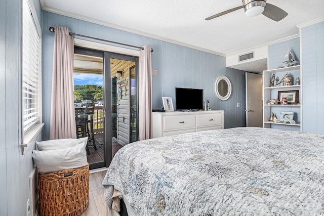 5601 N Ocean Blvd Unit E-113, Myrtle Beach, SC 29577 - bedroom with ornamental molding, access to outside, wood finished floors, a textured ceiling, and a ceiling fan