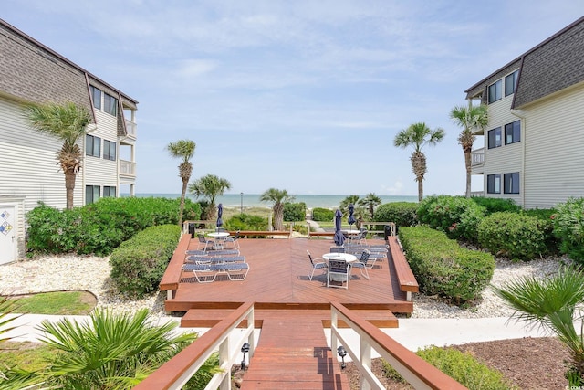 5601 N Ocean Blvd Unit E-113, Myrtle Beach, SC 29577 - view of property's community featuring outdoor dining area and a deck with water view