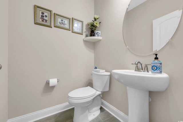932 Abernathy Pl, Surfside Beach, SC 29575 - bathroom with baseboards and wood finished floors
