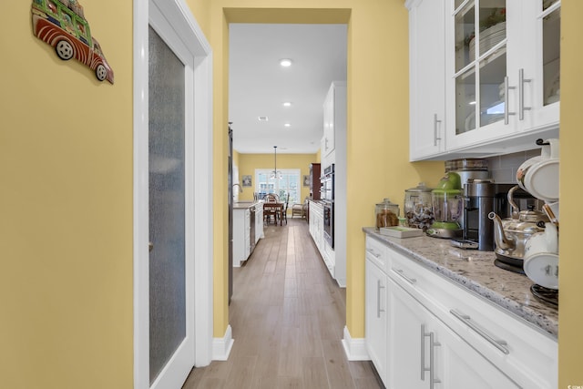 932 Abernathy Pl, Surfside Beach, SC 29575 - bar with light wood-type flooring, recessed lighting, and stainless steel dishwasher