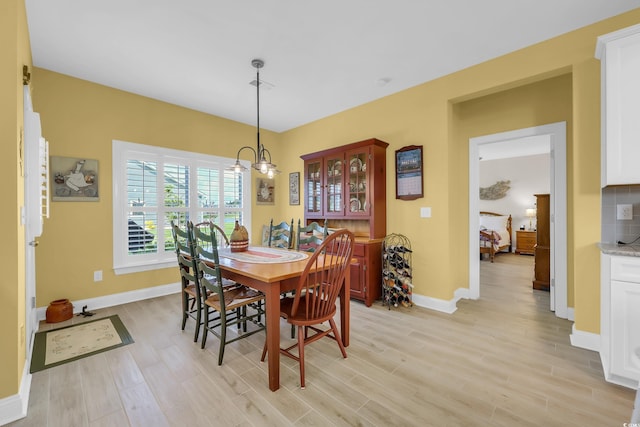 932 Abernathy Pl, Surfside Beach, SC 29575 - dining room featuring light wood-type flooring and a chandelier