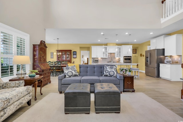 932 Abernathy Pl, Surfside Beach, SC 29575 - living area featuring a high ceiling, light wood-style floors, and recessed lighting