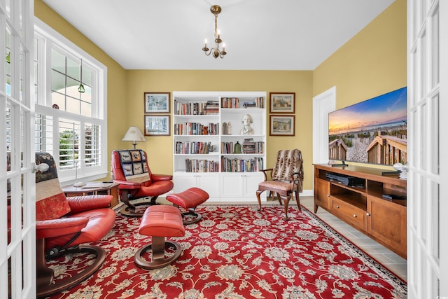 932 Abernathy Pl, Surfside Beach, SC 29575 - sitting room with a chandelier, french doors, built in features, and tile patterned flooring