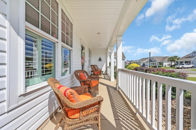 932 Abernathy Pl, Surfside Beach, SC 29575 - covered porch featuring a residential view