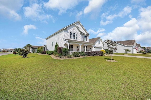 932 Abernathy Pl, Surfside Beach, SC 29575 - traditional-style house with a porch, a front yard, concrete driveway, and an attached garage