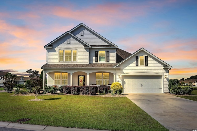 932 Abernathy Pl, Surfside Beach, SC 29575 - traditional-style house featuring a porch, driveway, a yard, a garage, and a shingled roof