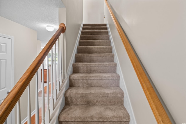 2131 Cass Lake Dr Unit 662, Carolina Shores, NC 28467 - staircase with a textured ceiling