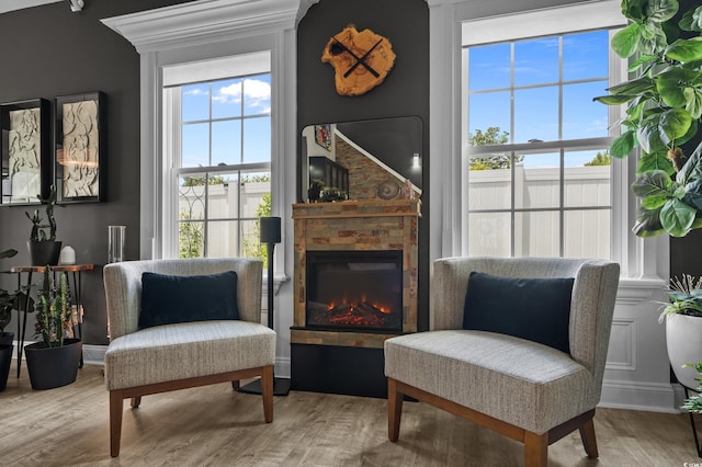 752 Hobonny Loop, Longs, SC 29568 - living area featuring wood finished floors and a glass covered fireplace