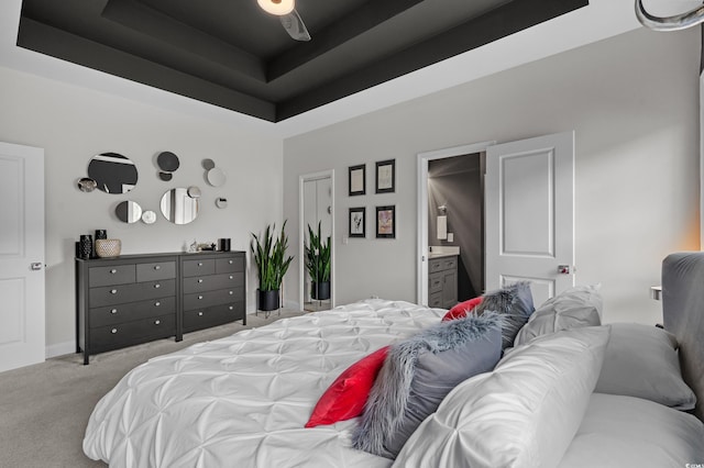 752 Hobonny Loop, Longs, SC 29568 - carpeted bedroom with a tray ceiling and ensuite bathroom