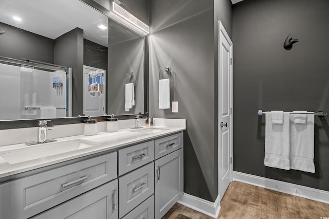 752 Hobonny Loop, Longs, SC 29568 - bathroom with wood finished floors, double vanity, and a shower