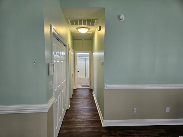 1028 Cherry Tree Ln, North Myrtle Beach, SC 29582 - corridor featuring attic access and dark wood-type flooring