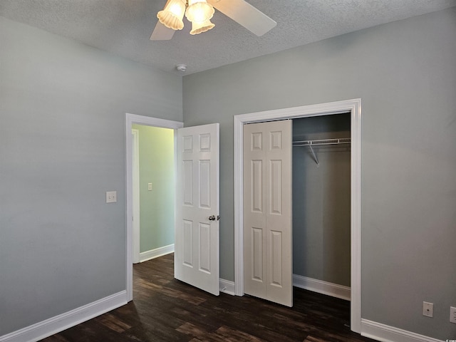 1028 Cherry Tree Ln, North Myrtle Beach, SC 29582 - unfurnished bedroom with dark wood-style floors, a textured ceiling, a closet, and ceiling fan