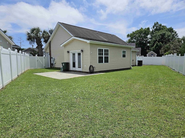 1028 Cherry Tree Ln, North Myrtle Beach, SC 29582 - back of house featuring a patio area, a fenced backyard, french doors, and a gate