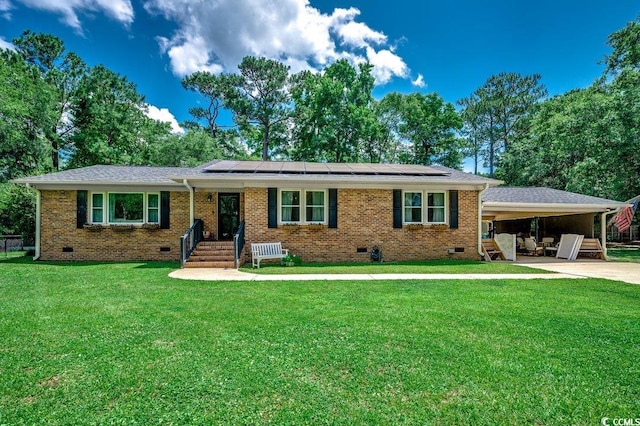 4189 Schoolhouse Cir, Little River, SC 29566 - ranch-style home featuring crawl space, roof mounted solar panels, a front yard, and brick siding