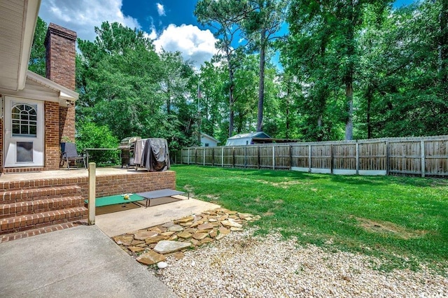 4189 Schoolhouse Cir, Little River, SC 29566 - fenced backyard featuring a patio and view of scattered trees