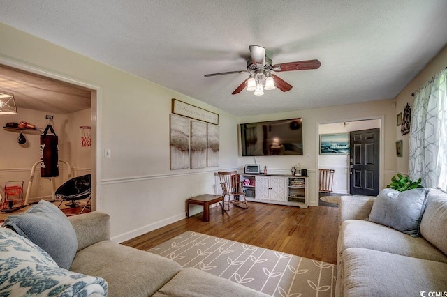 4189 Schoolhouse Cir, Little River, SC 29566 - living room featuring a ceiling fan and wood finished floors