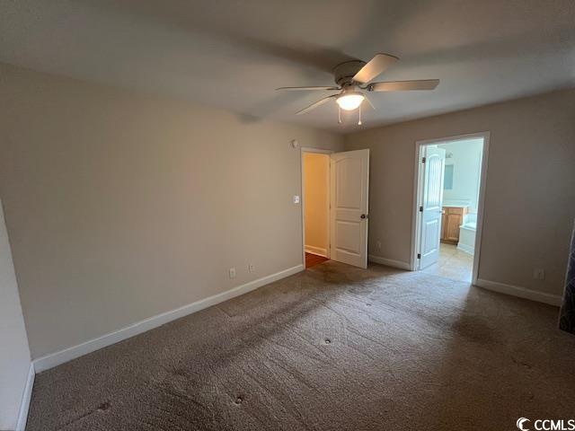 298 Weyburn St, Myrtle Beach, SC 29579 - unfurnished bedroom with carpet floors, ensuite bath, and a ceiling fan