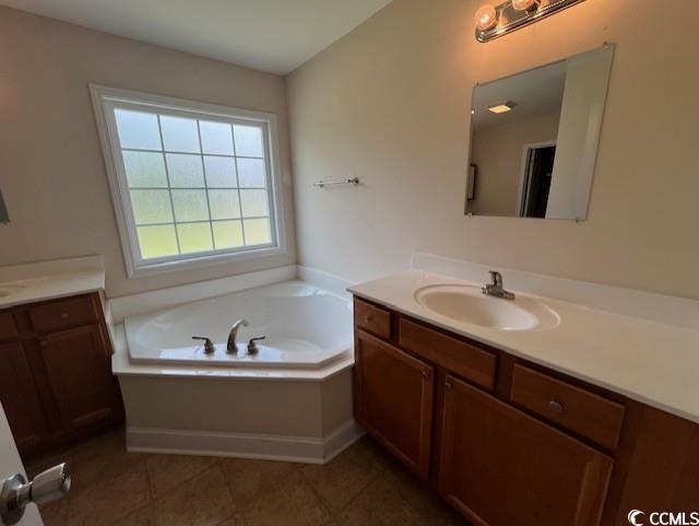 298 Weyburn St, Myrtle Beach, SC 29579 - full bathroom with two vanities, a bath, and tile patterned flooring