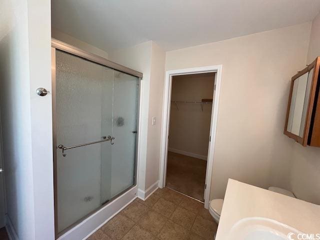 298 Weyburn St, Myrtle Beach, SC 29579 - full bathroom with a stall shower, a spacious closet, and vanity