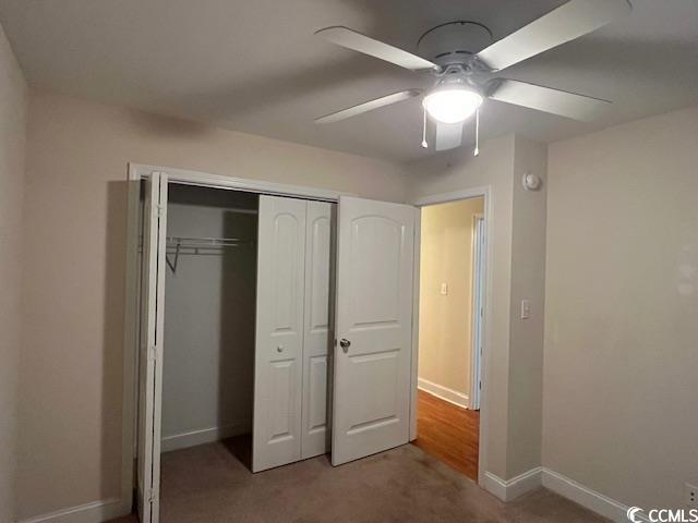 298 Weyburn St, Myrtle Beach, SC 29579 - unfurnished bedroom with carpet, a closet, and a ceiling fan