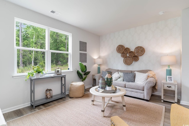 1402 Nokota Dr, Conway, SC 29526 - living room featuring wallpapered walls, wood finished floors, and plenty of natural light